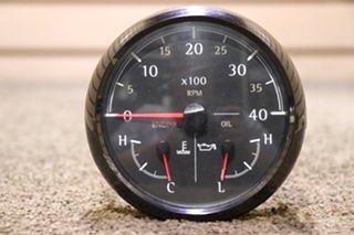 USED 3 IN 1 MEDALLION TACH / ENGINE / OIL DASH GAUGE
