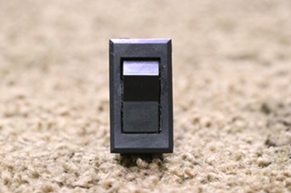 USED BLACK RESET ROCKER SWITCH