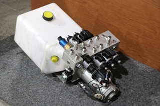 USED 414850 LIPPERT COMPONENTS HYDRAULIC PUMP